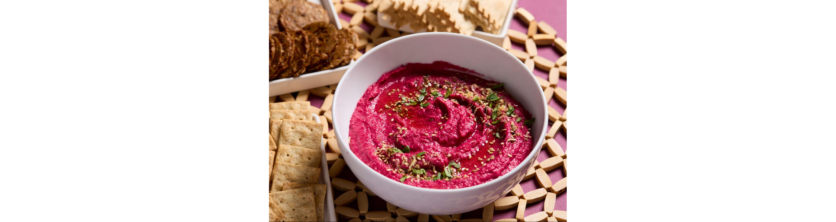 A bowl of beetroot hummus.