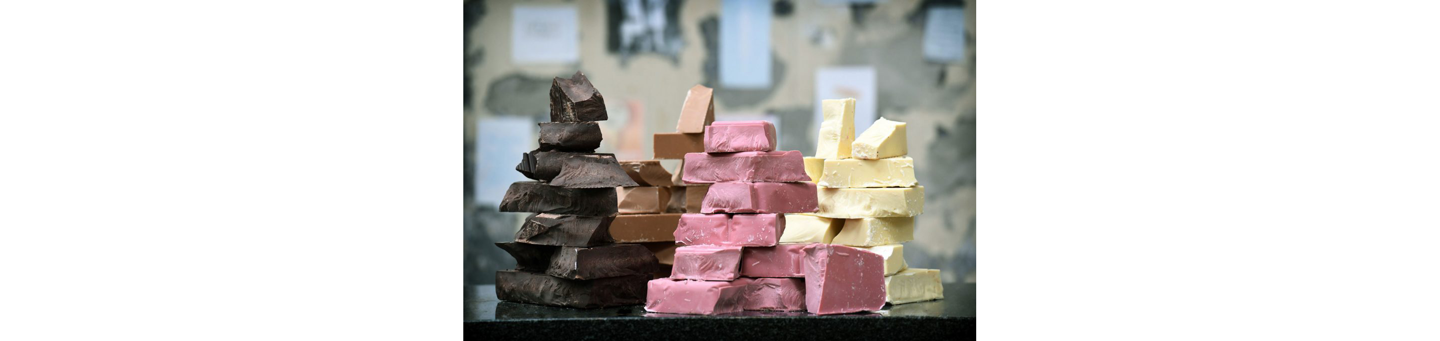 Chunks of the four chocolates: dark, milk, white and ruby.