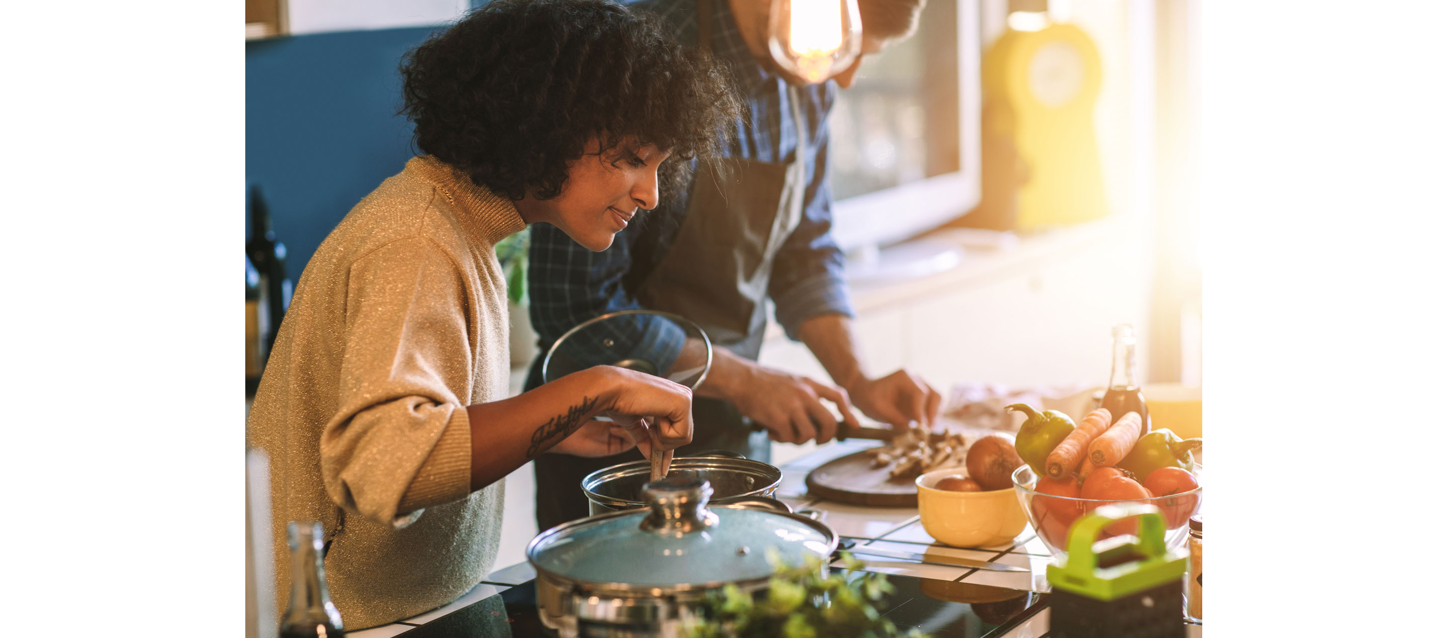 Two people making food.