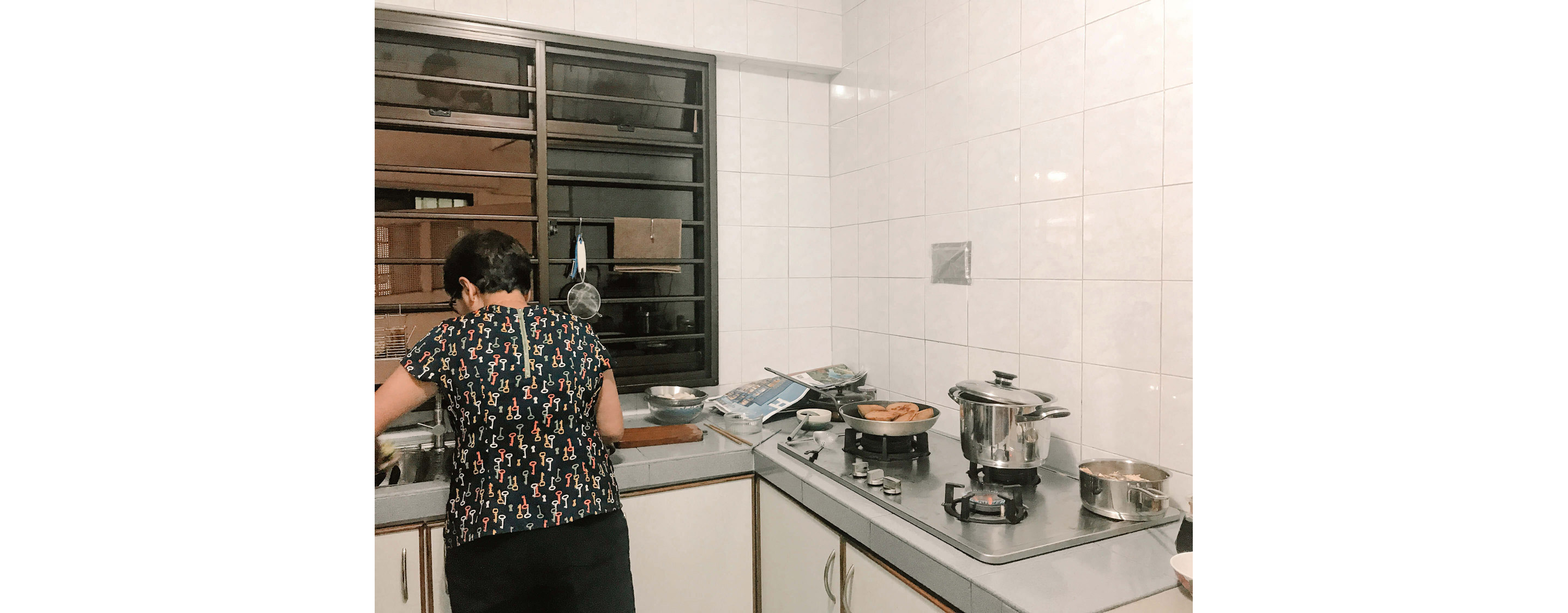A mom working diligently in her kitchen.