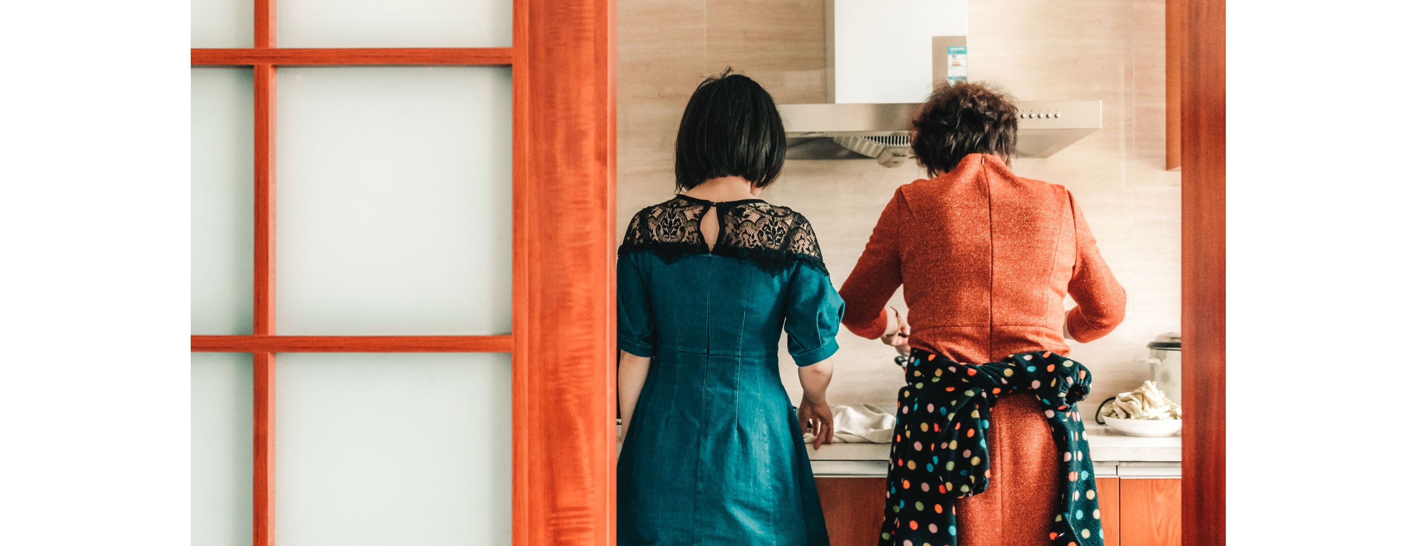 A mom and daughter enjoying cooking together.