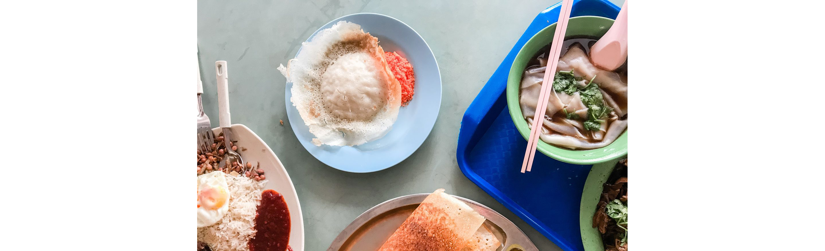 A table filled with a variety of Asian dishes.