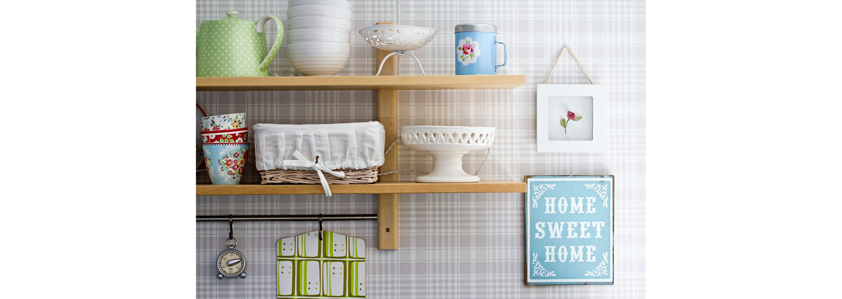 Shelves displaying dishes and other kitchen items.