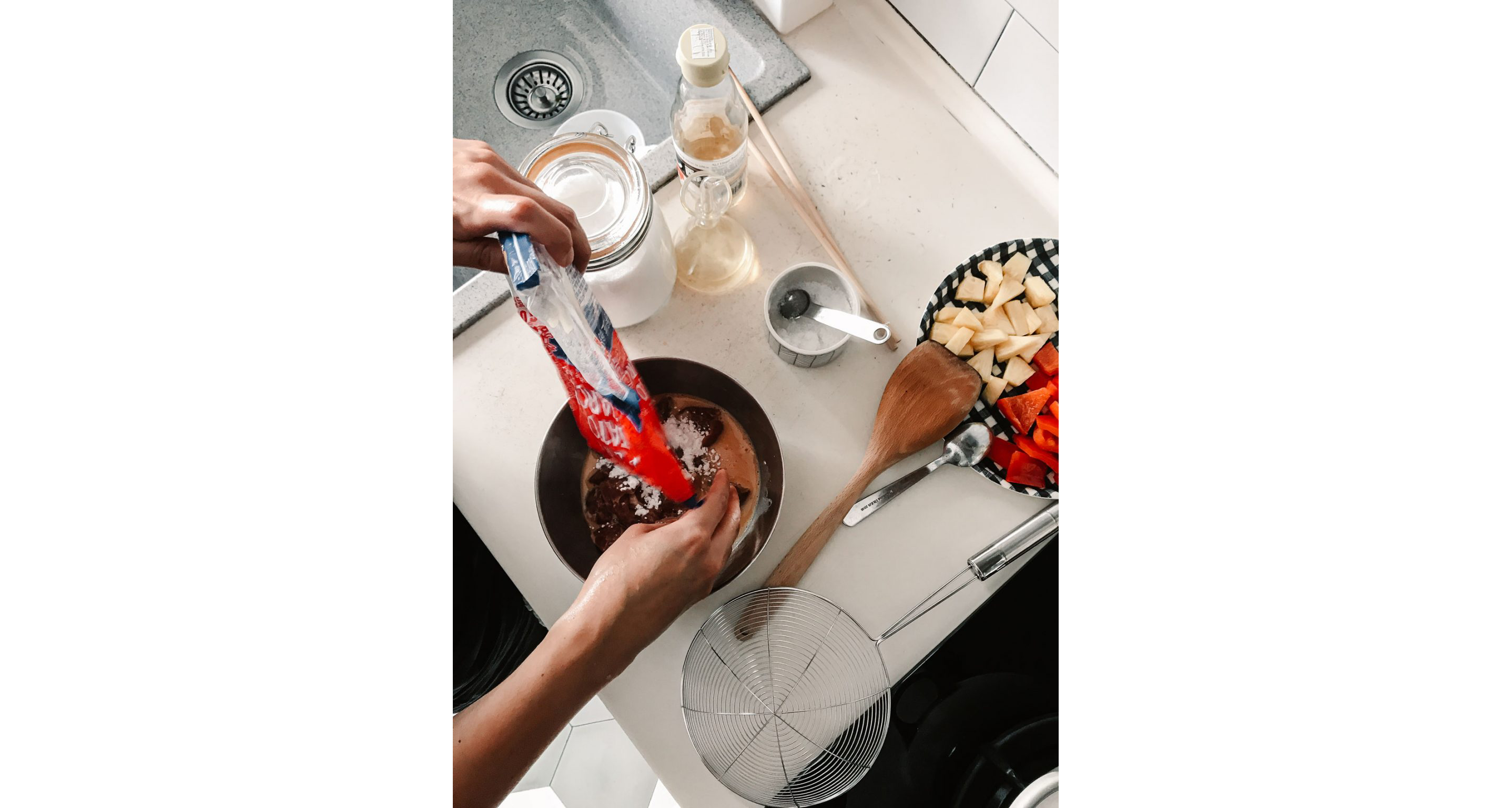 Melly Fong pouring cornstarch into batter.