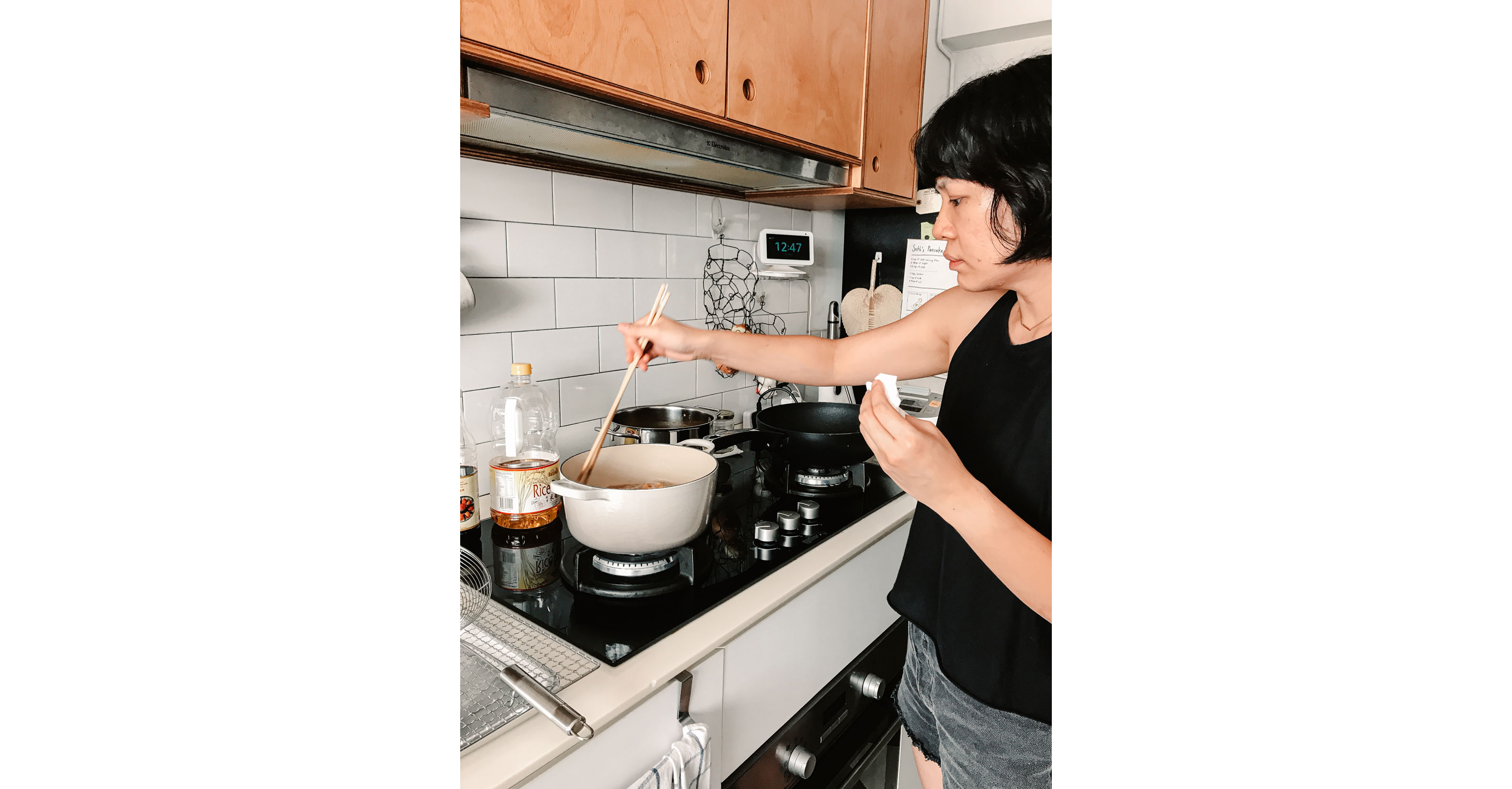 Melly Fong tending to her food cooking on the stove.