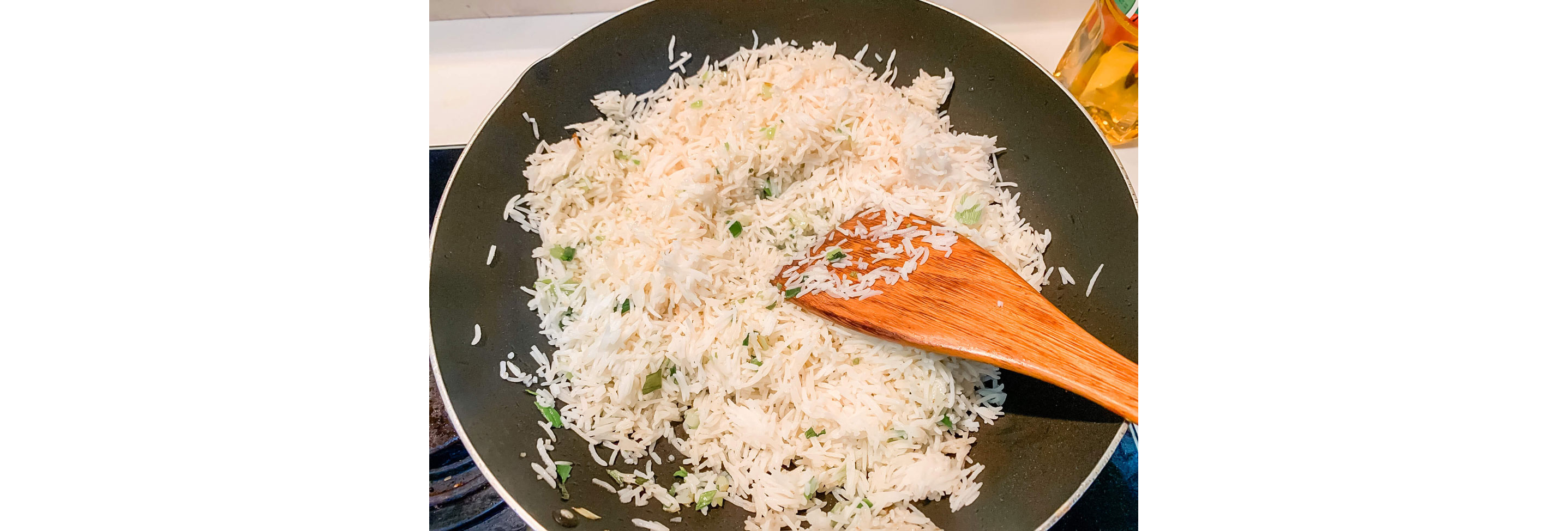 White rice frying in a wok.