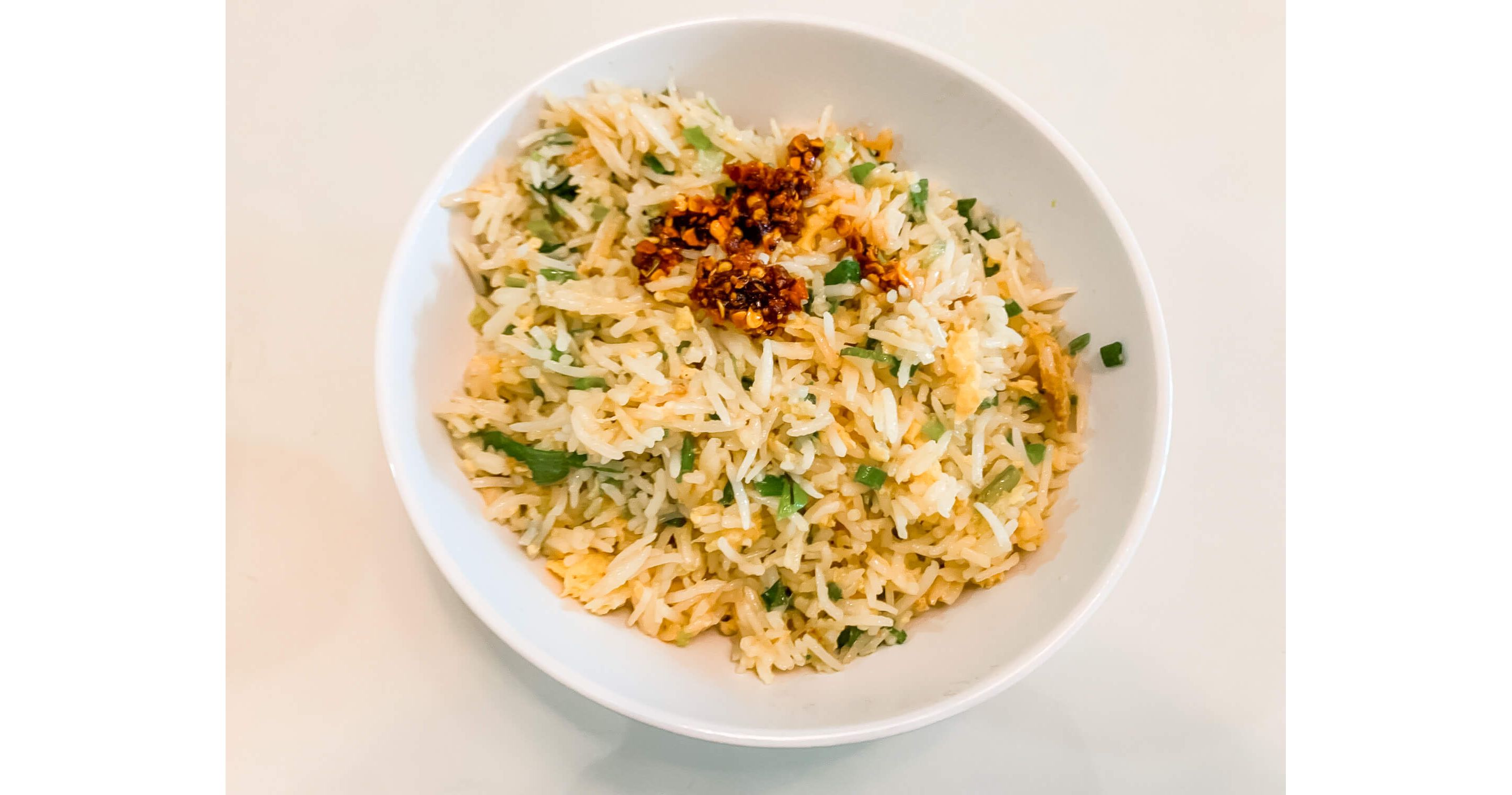 A large bowl of egg fried rice.