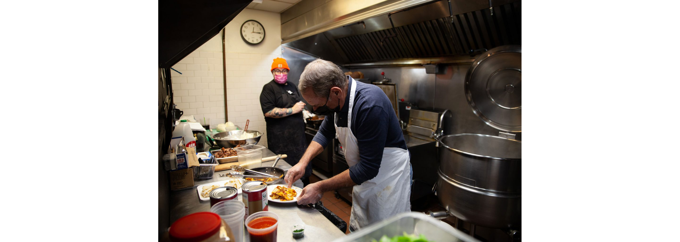 Andrew Abruzzese and Matthew Levin working in the kitchen of Pineville Tavern.