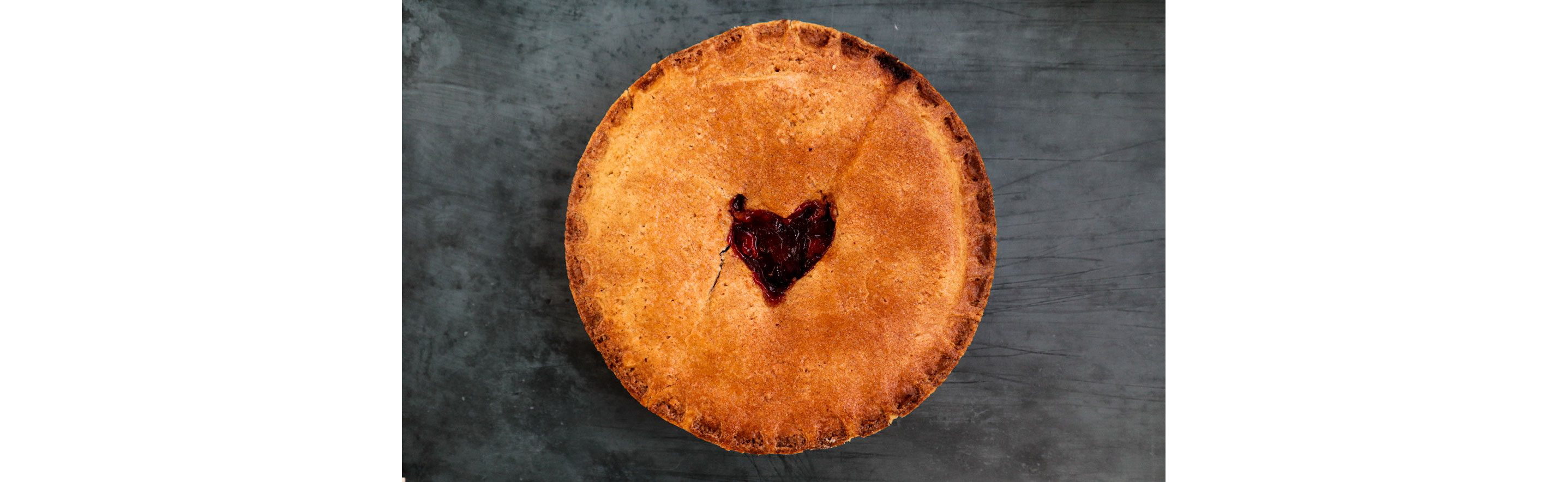 A pie with a heart-shaped center.