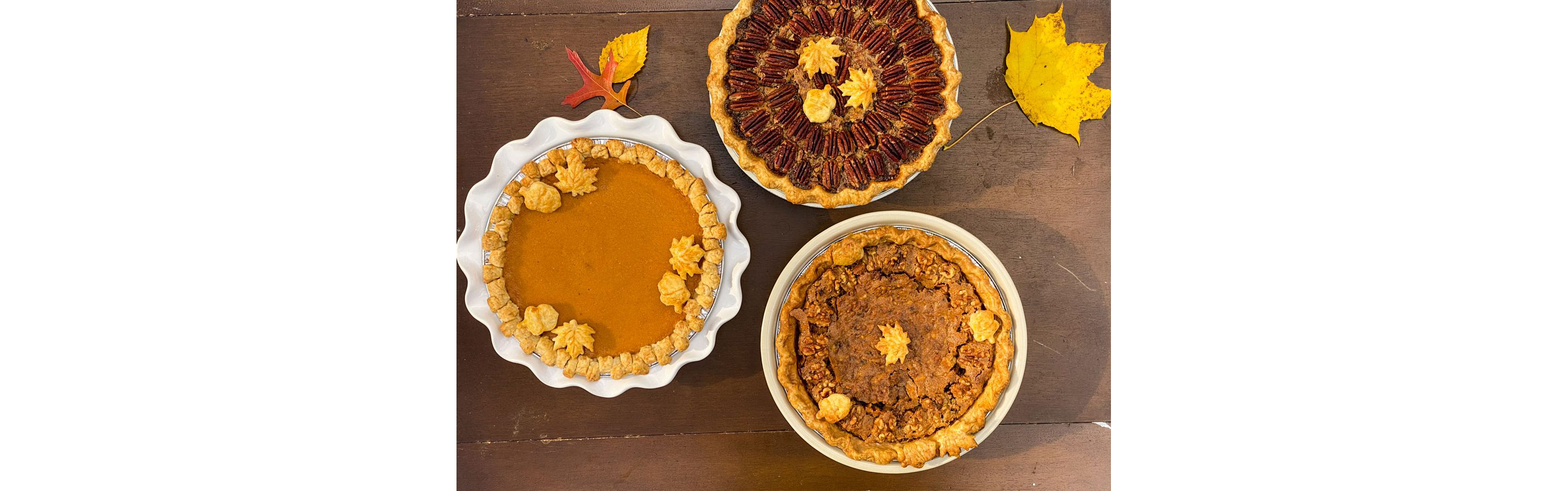 Three fall-themed pies.