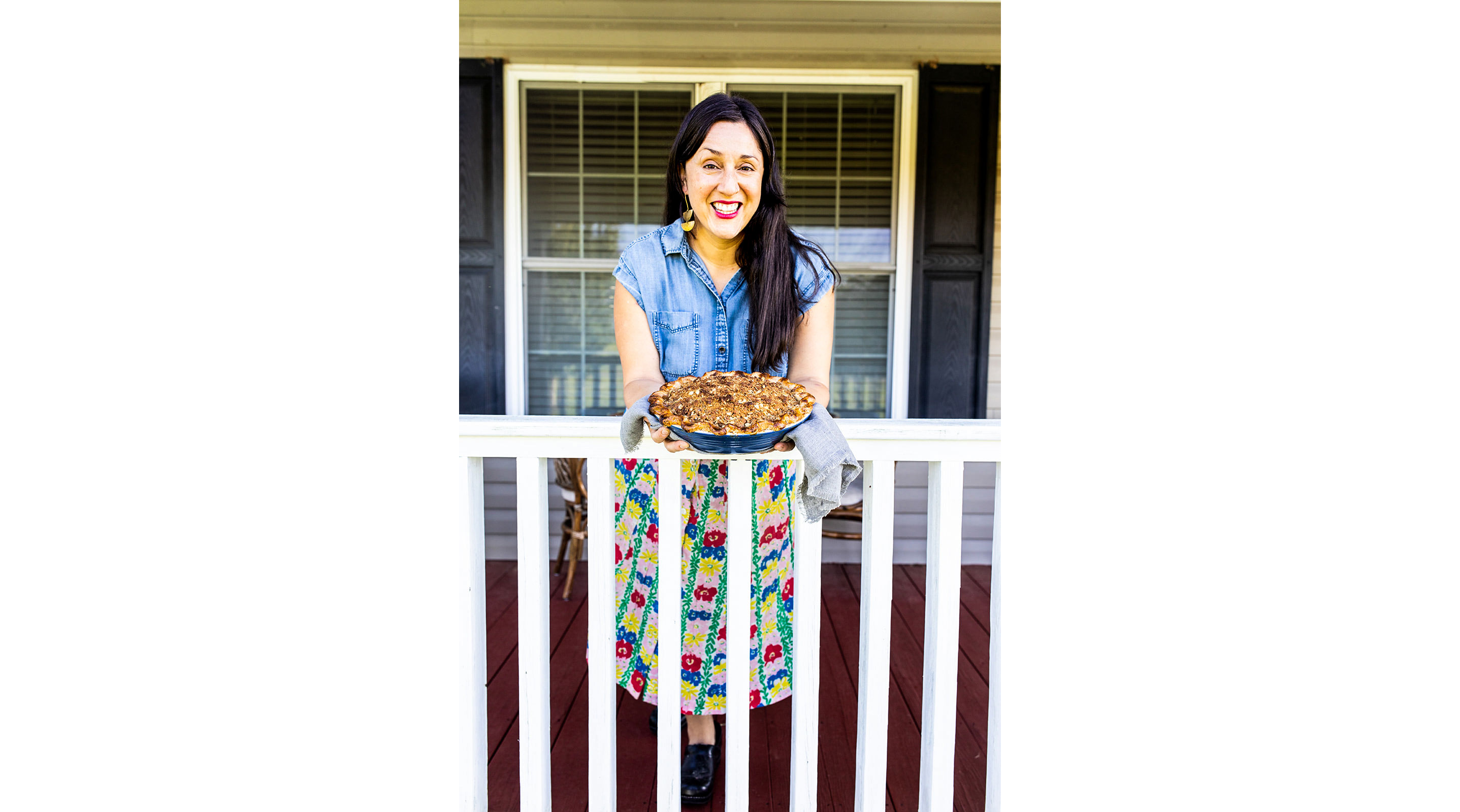 Holding out a pie for all to see.