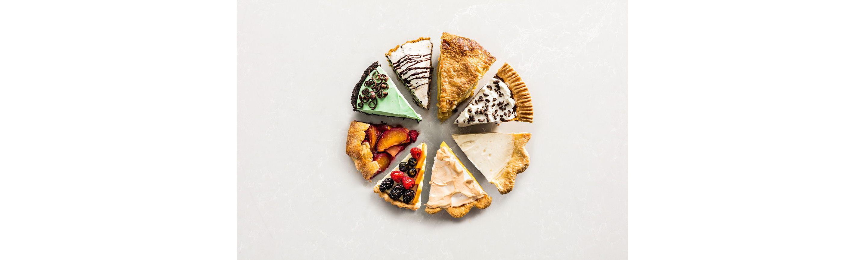 A variety of different slices of pie.