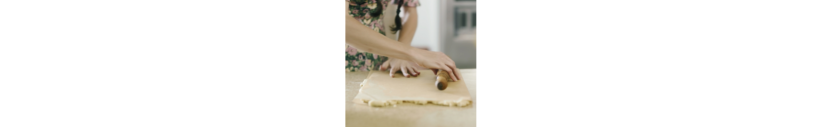 Loria Stern gently rolling out dough.