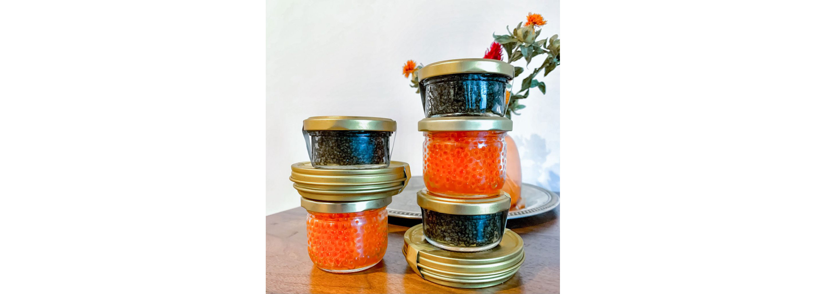 A variety of jars and containers of caviar.
