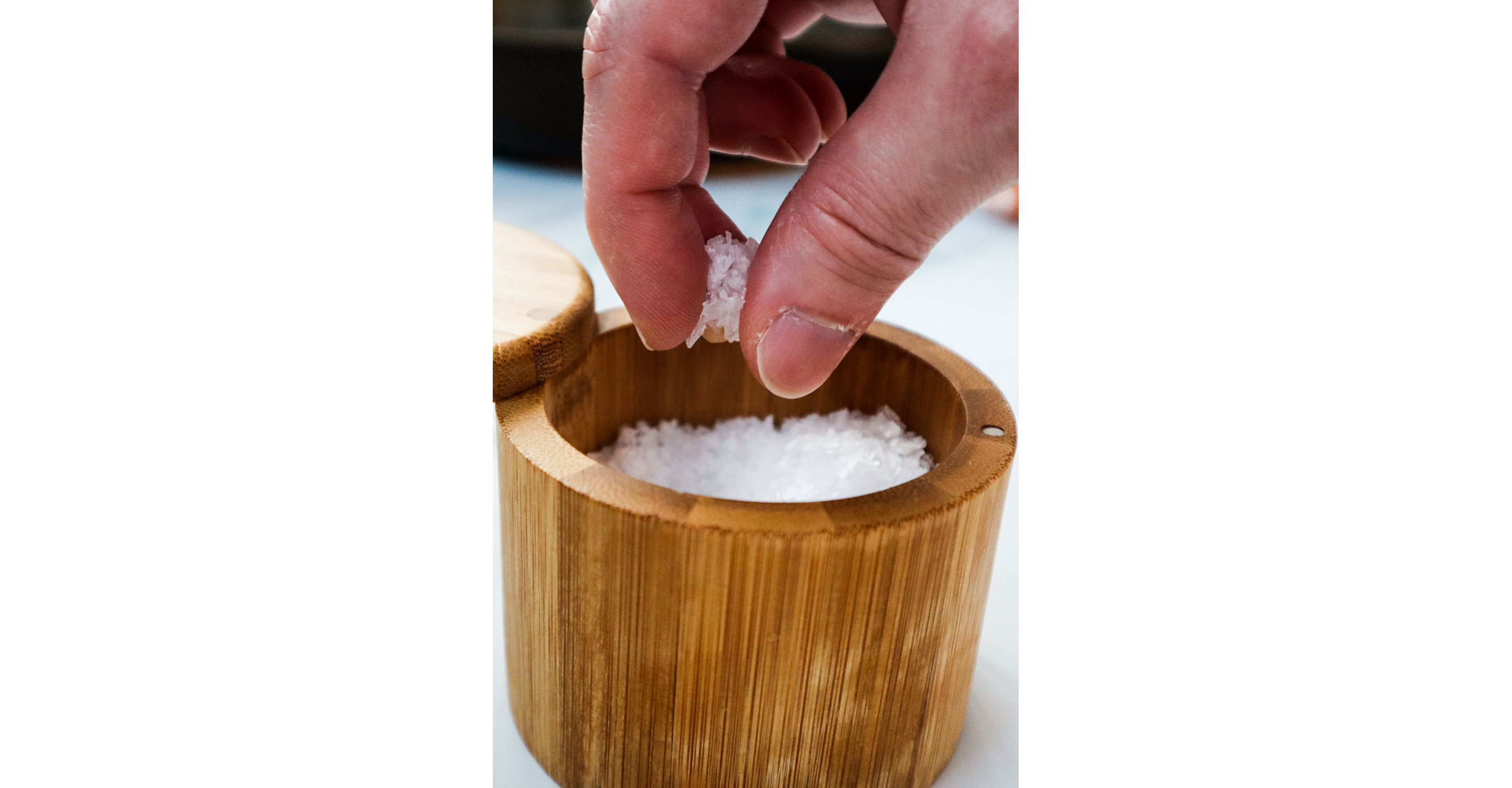 A person holidng a pinch of salt.