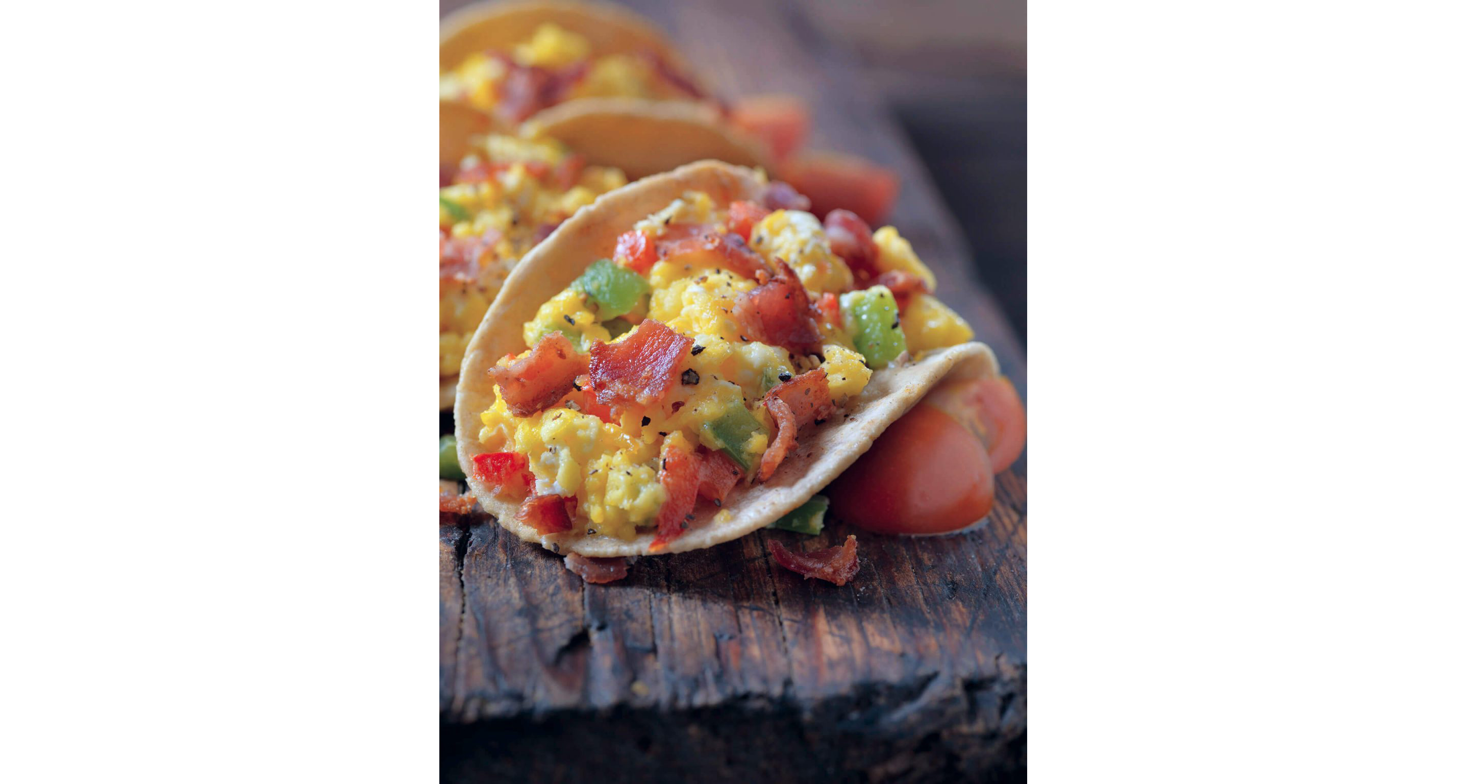 A classic breakfast taco with scrambled eggs, bacon and peppers.