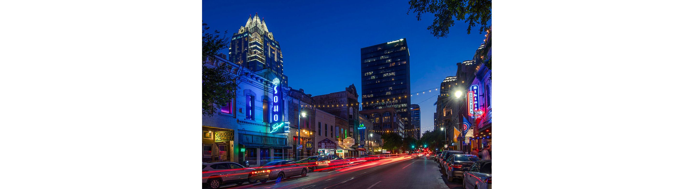A lively cityscape of the city of Austin, Texas at night.