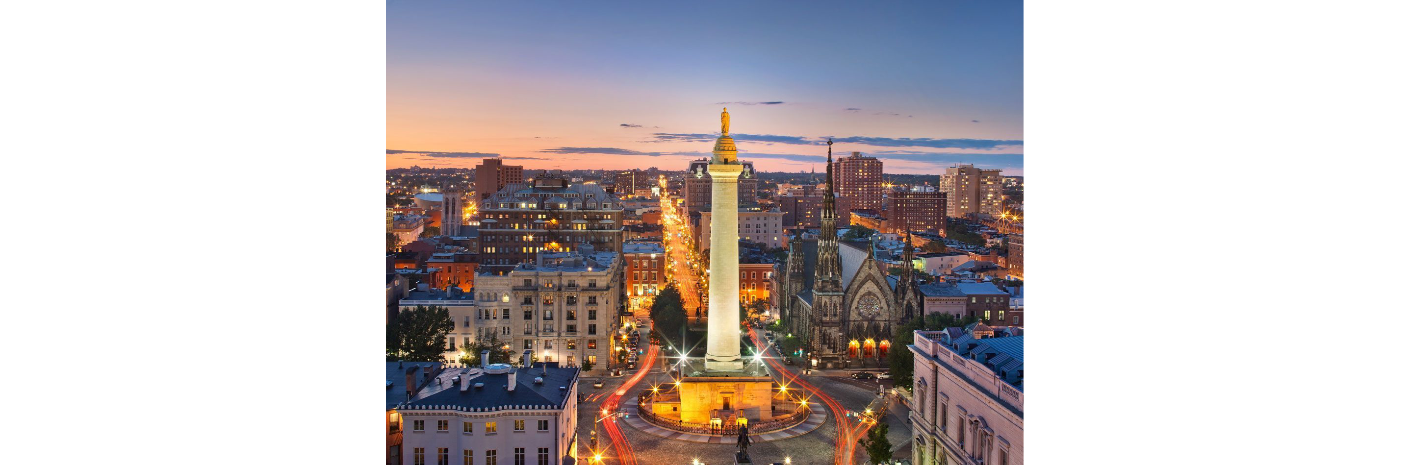An evening cityscape featuring the Washington Monument.