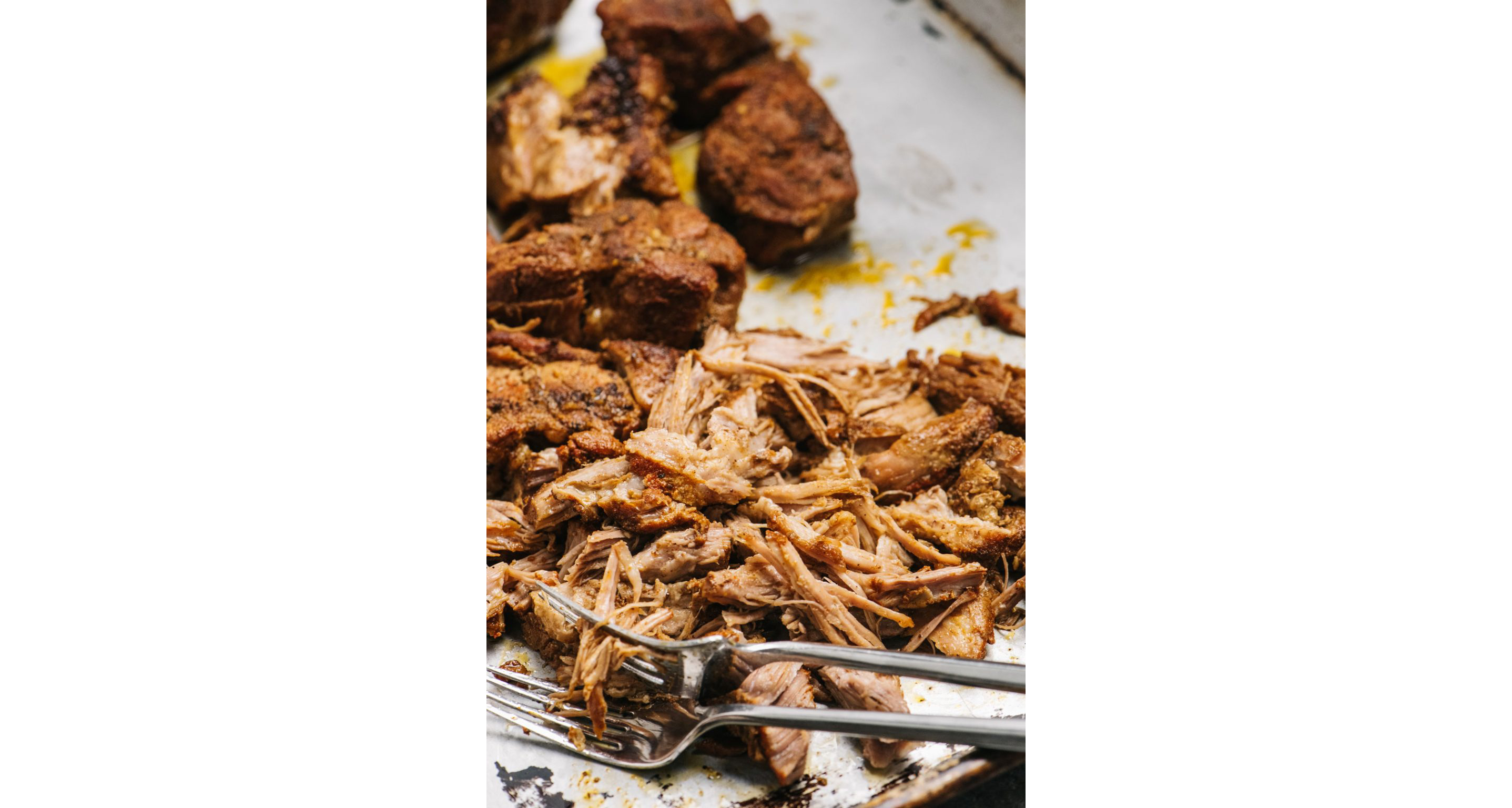 Cooked pork shredded into pulled pork.