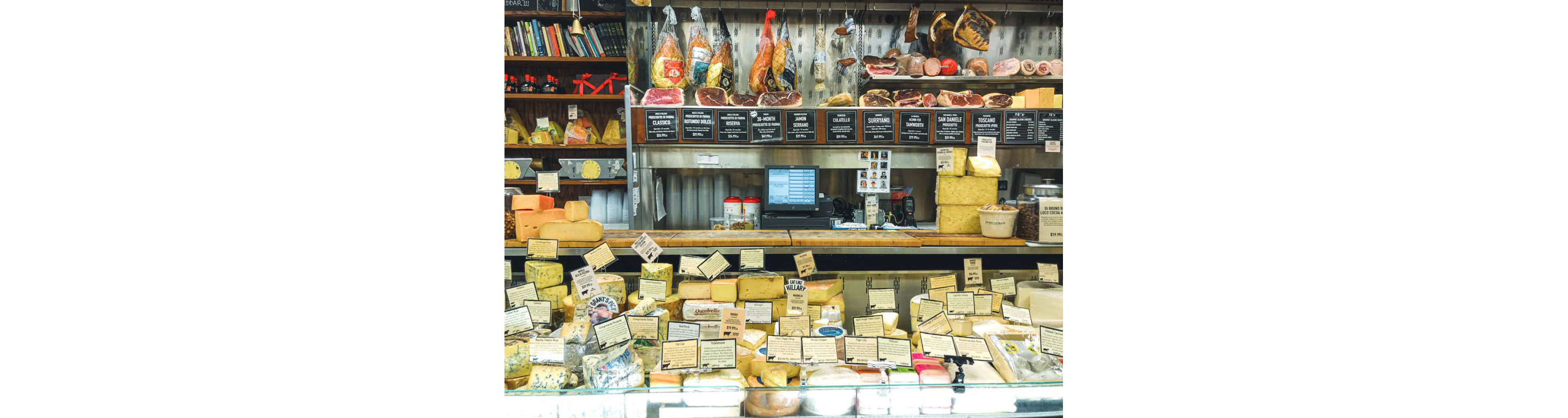 A store displaying a variety of high-quality meats and cheeses.