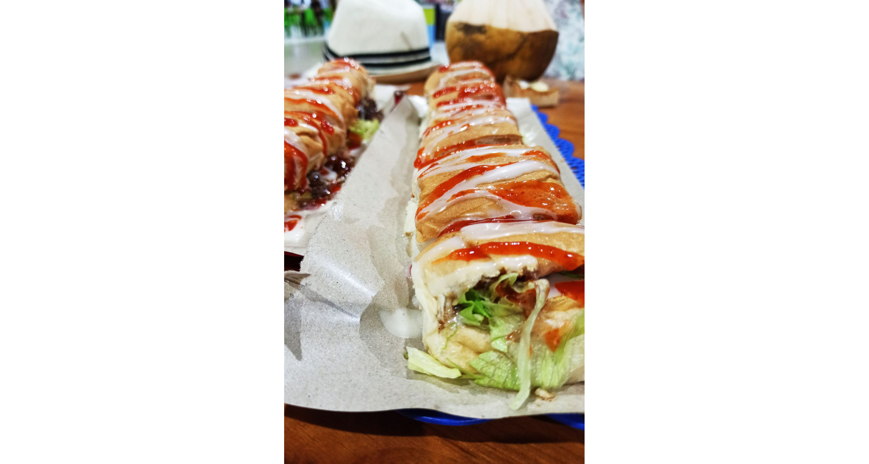 Two chicken roti johns ready to be eaten.