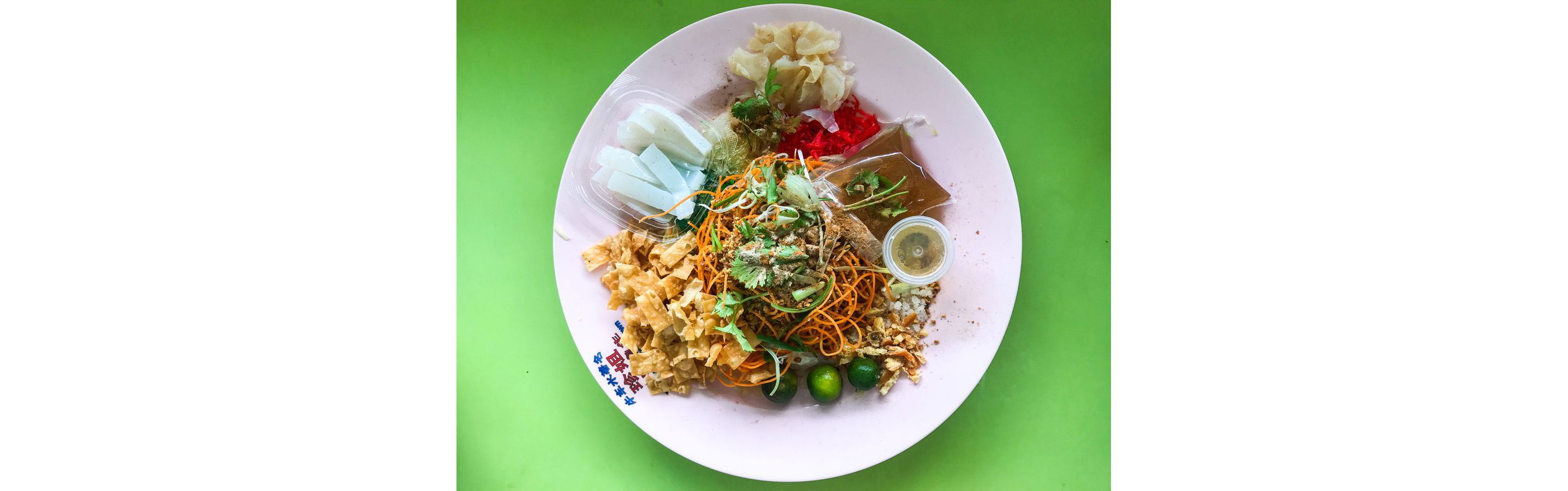 Raw fish salad served with different sauces and garnishes.