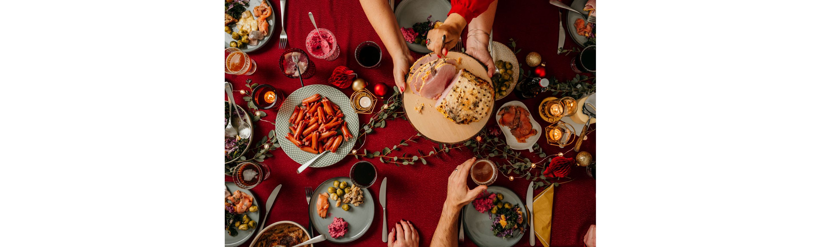 A dining room table covered in festive dishes and decor.