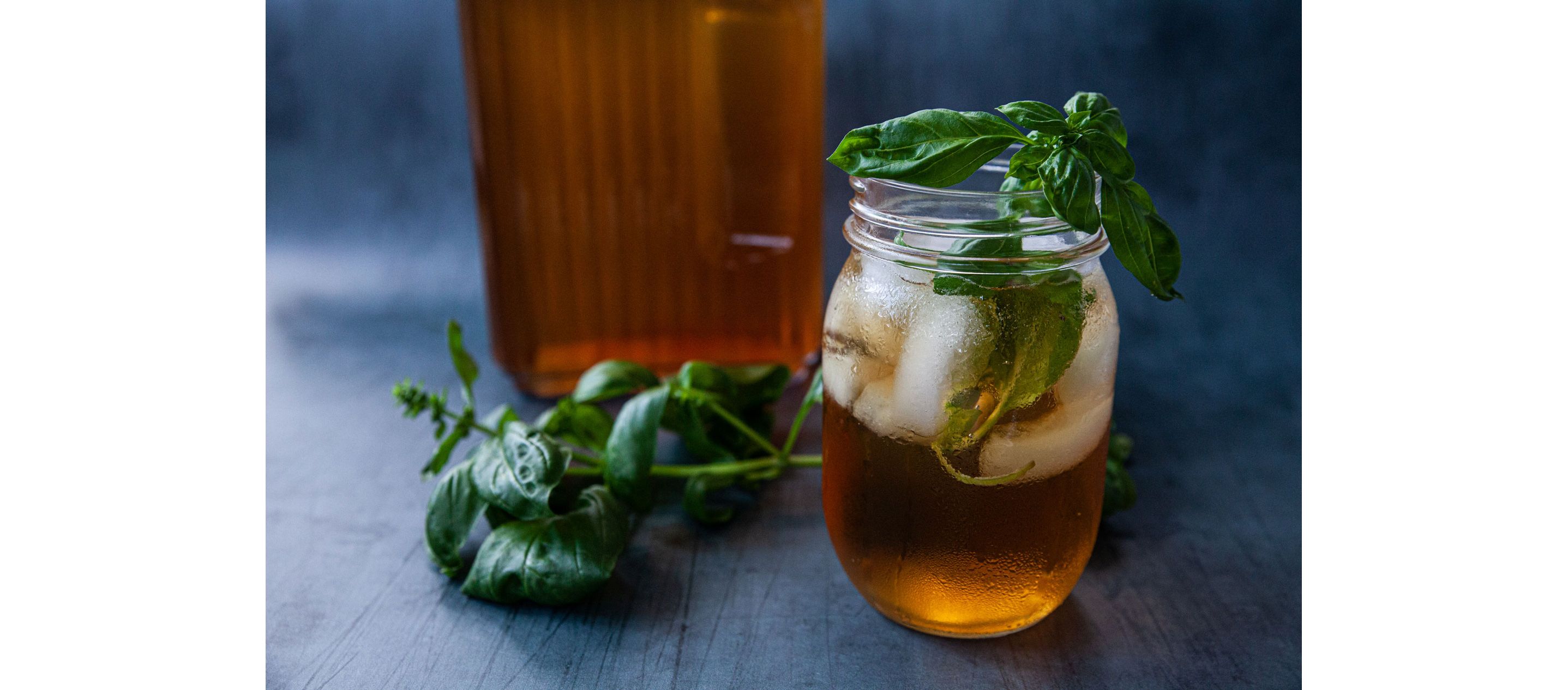 A glass mason jar filled with cold, refreshing iced tea.
