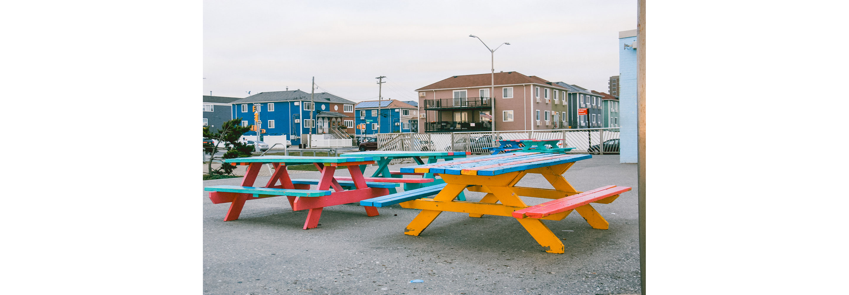 Colorful picnic tables in a park.