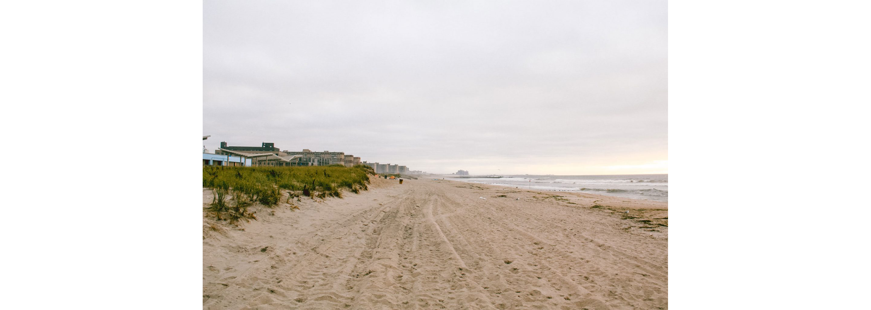 A long strip of sand beach.