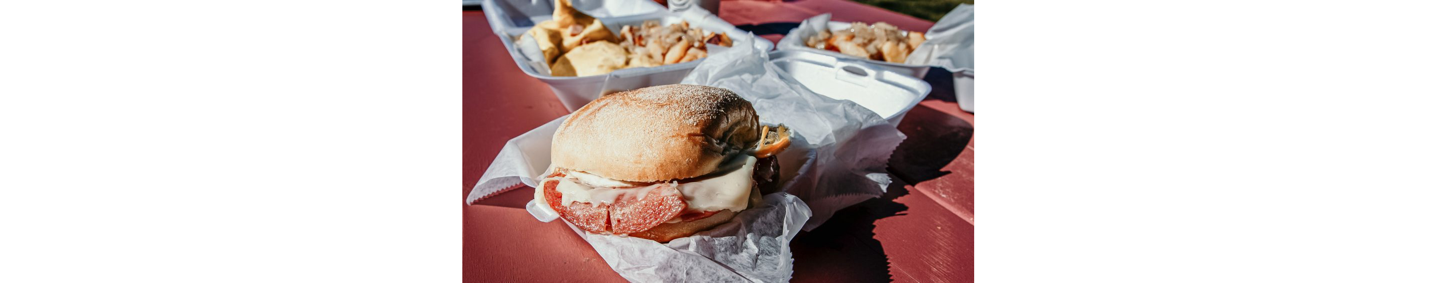 Three takeaway containers filled with fresh eats.