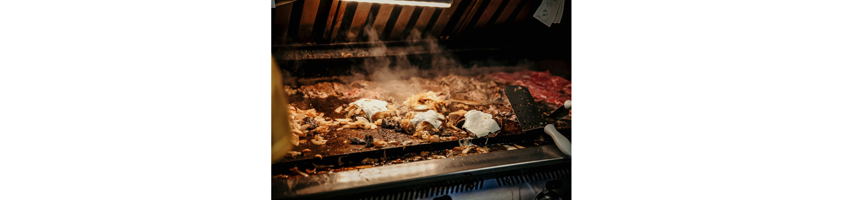 A fully loaded grill covered in food at Donkey's Place.