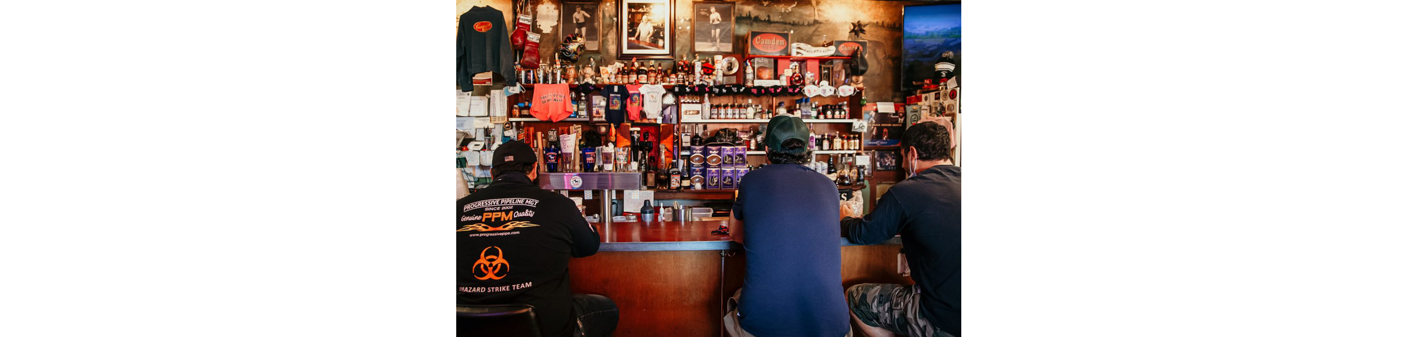 People sitting at the well-stocked bar of Donkey's Place.