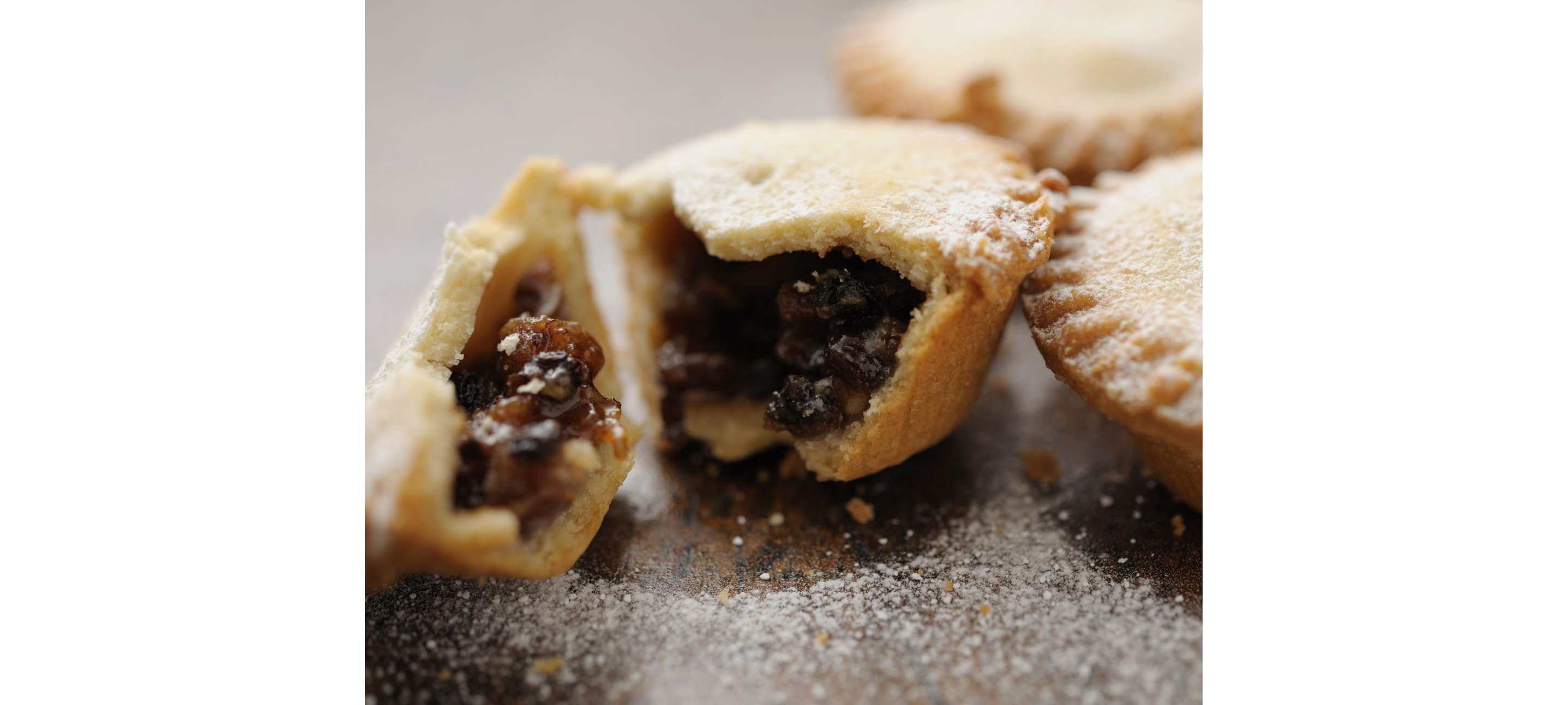A mince pie broken apart to show its inside.