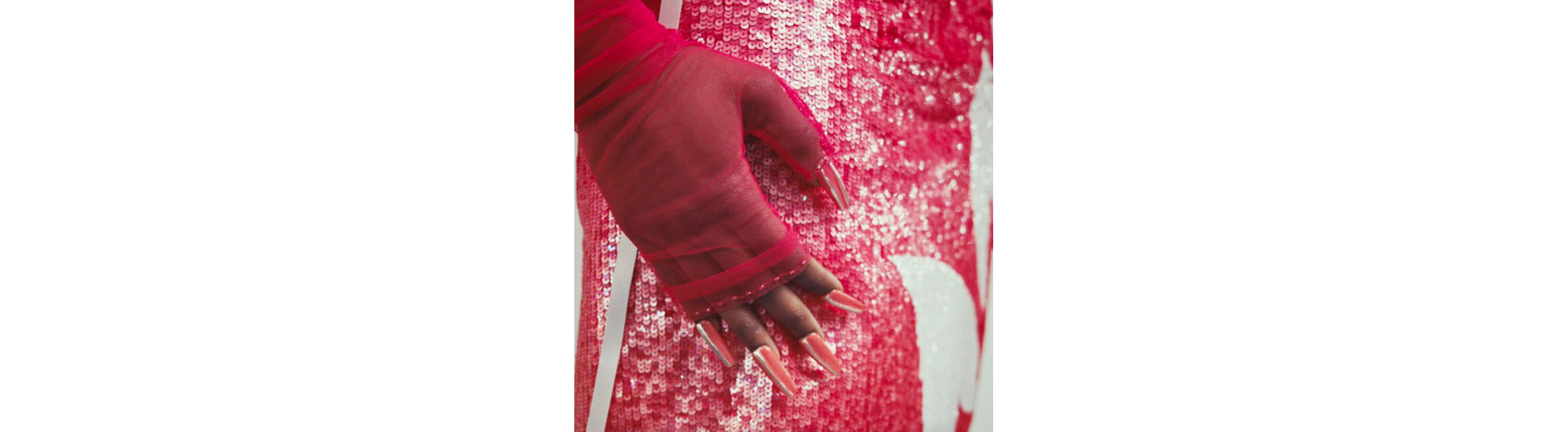 A close up of the gloves and skirt of Look Twelve.