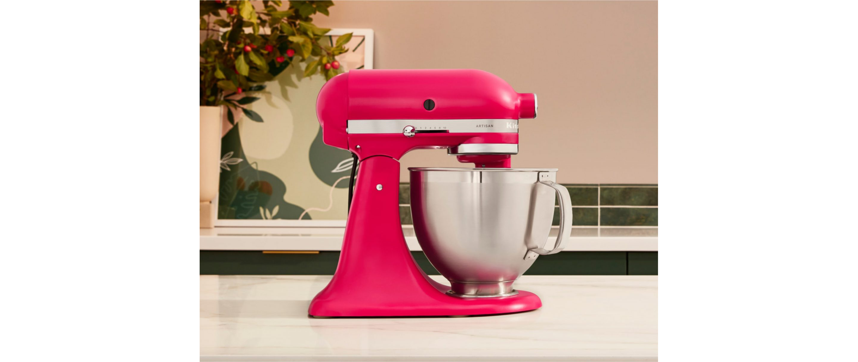  The Artisan® Series Stand Mixer in Hibiscus on a countertop. 