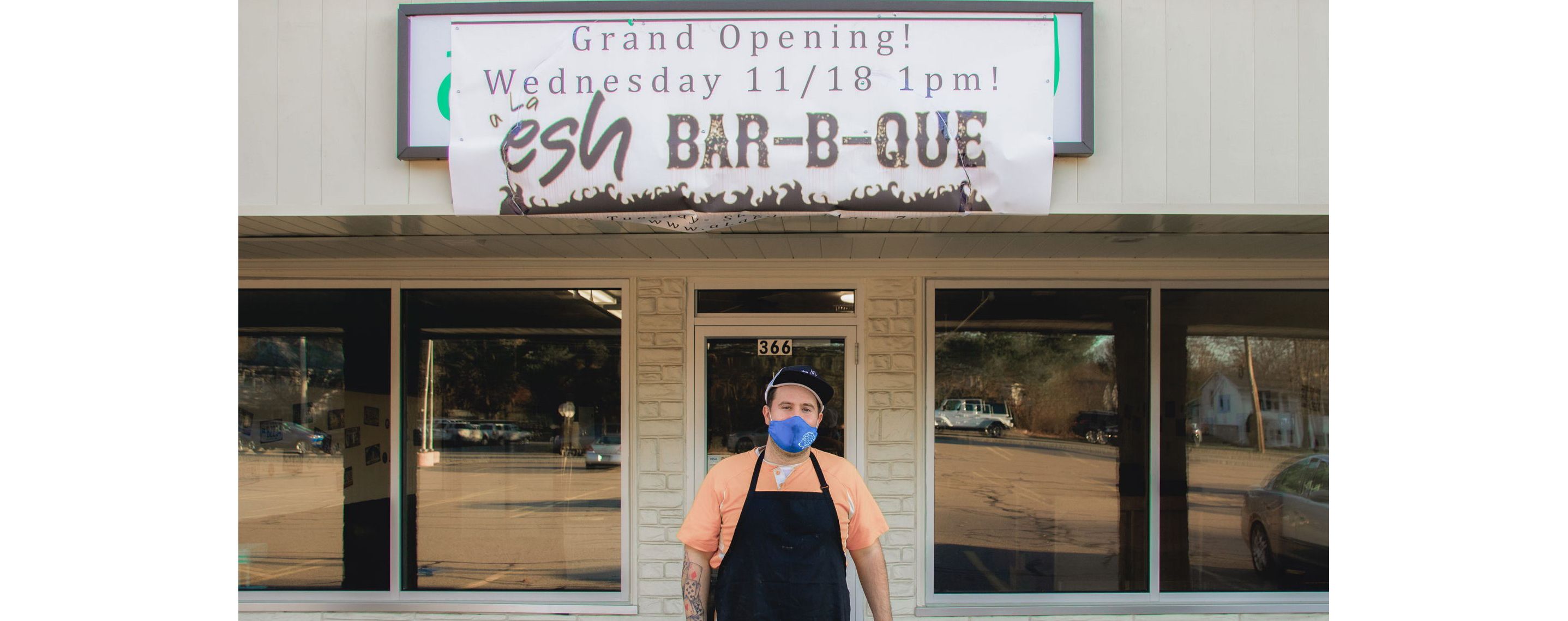 Avi Shemtov standing in front of his restaurant, A La Esh.