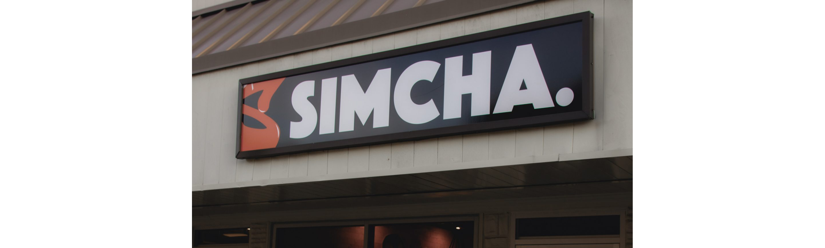The restaurant sign for Simcha.