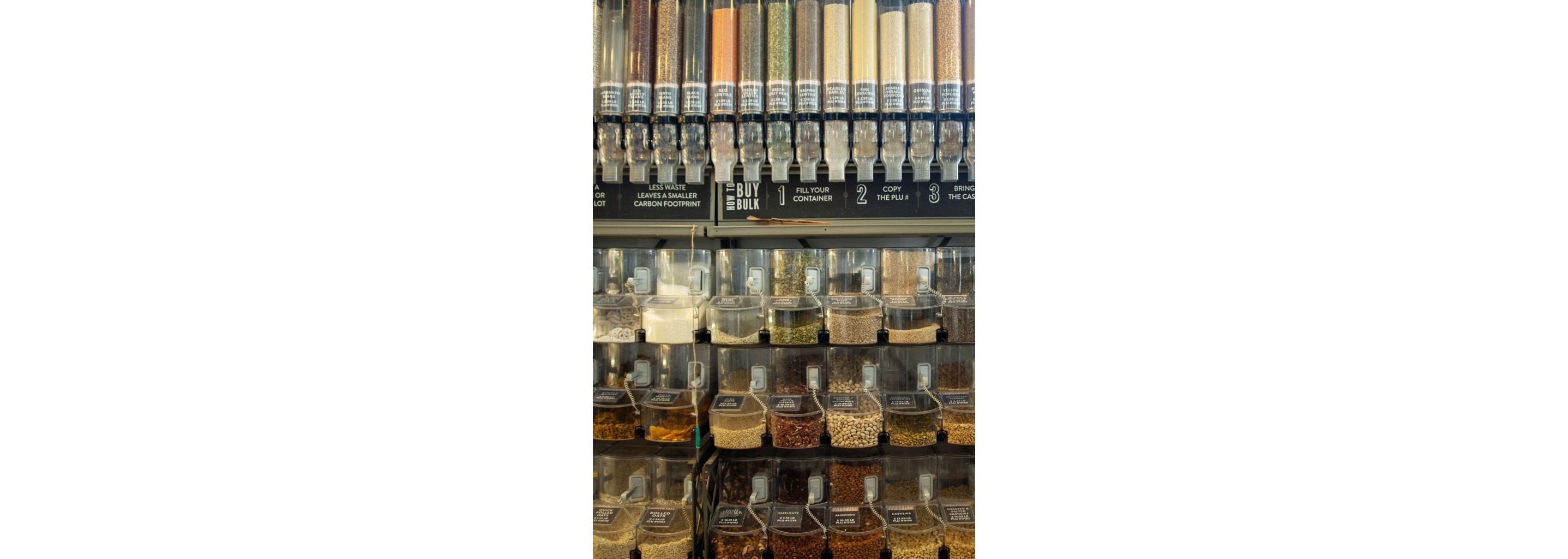 A variety of different grains and beans in their own individual containers.