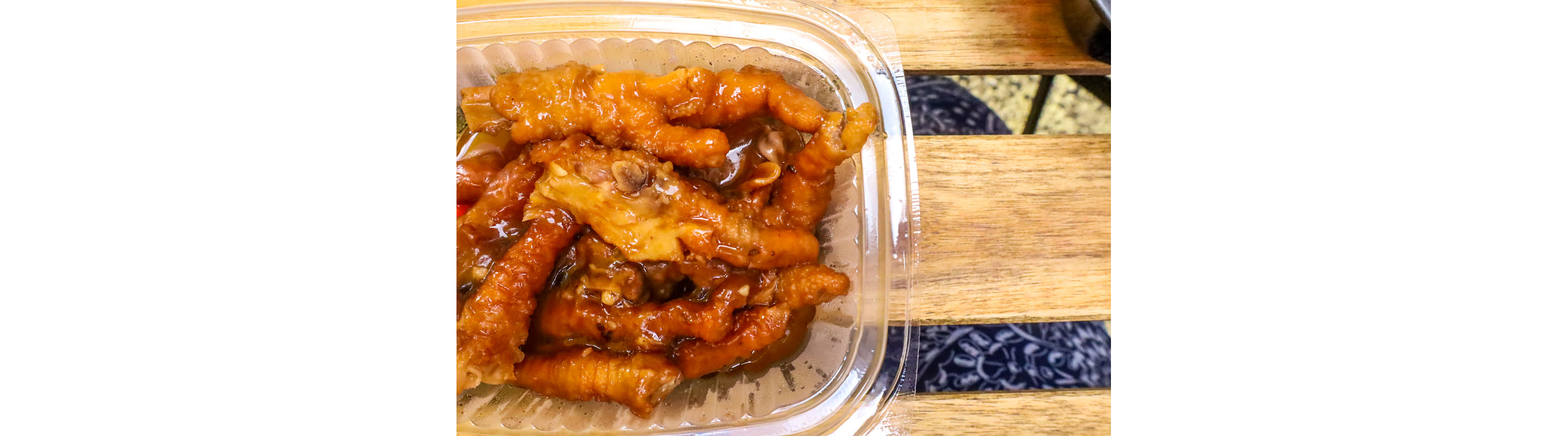 A clear container filled with delicous food.