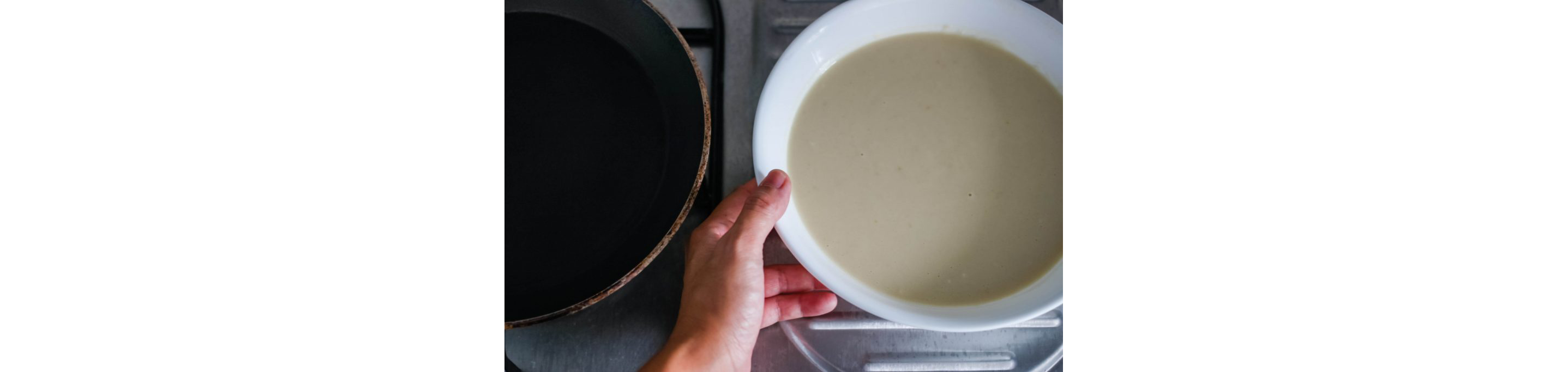 A large white bowl of crepe mixture.