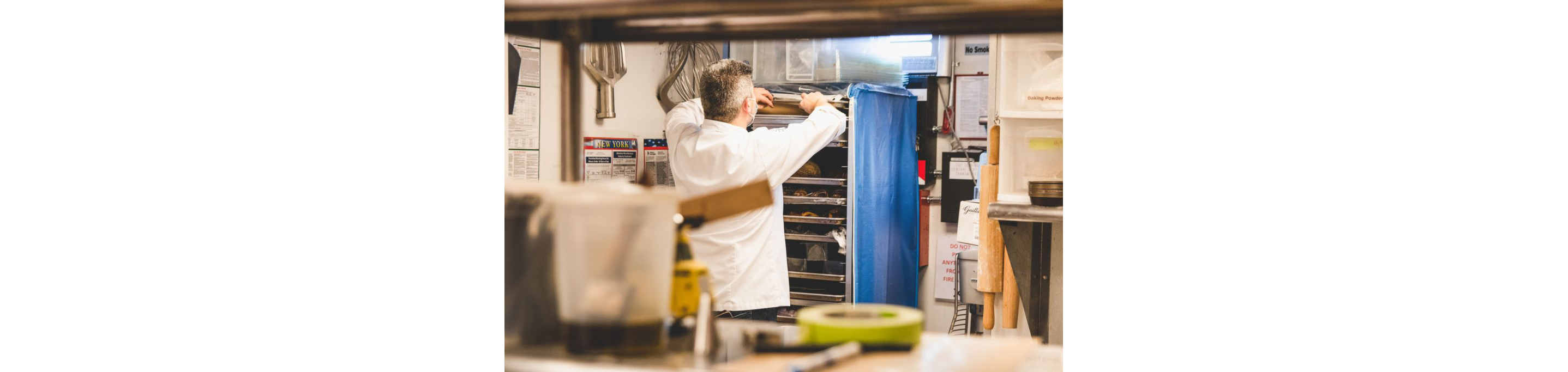 Chef Christophe Toury placing the chocolate into his baker's rack.