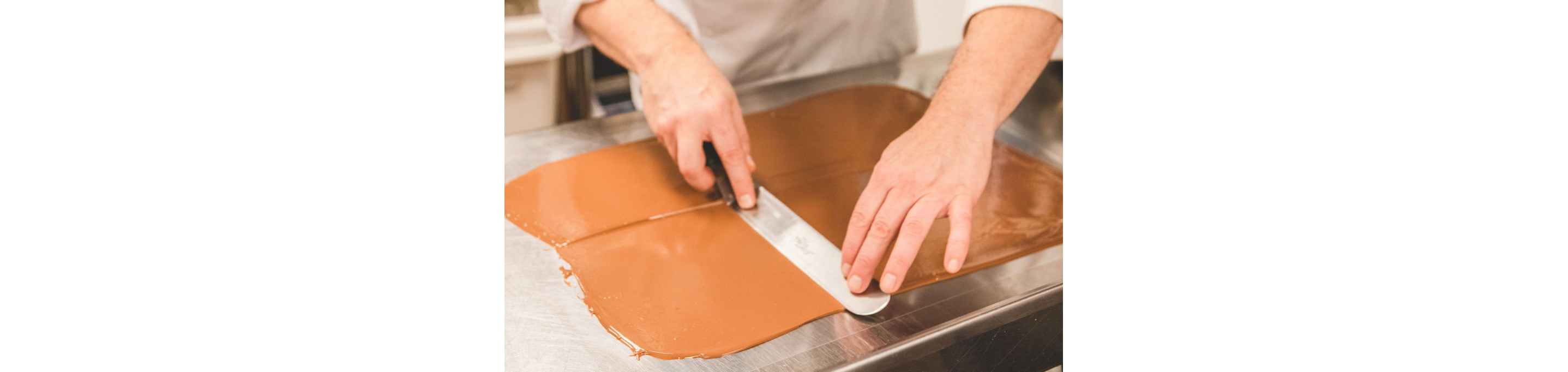 Chef Christophe Toury skillfully spreading chocolate.