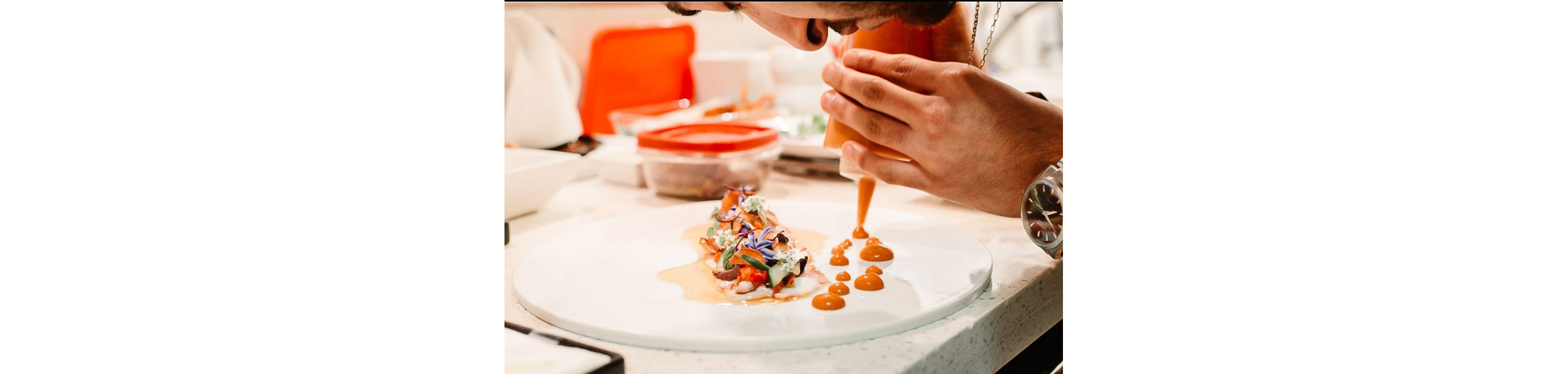 Behzad Jamshidi meticulously working over a dish.