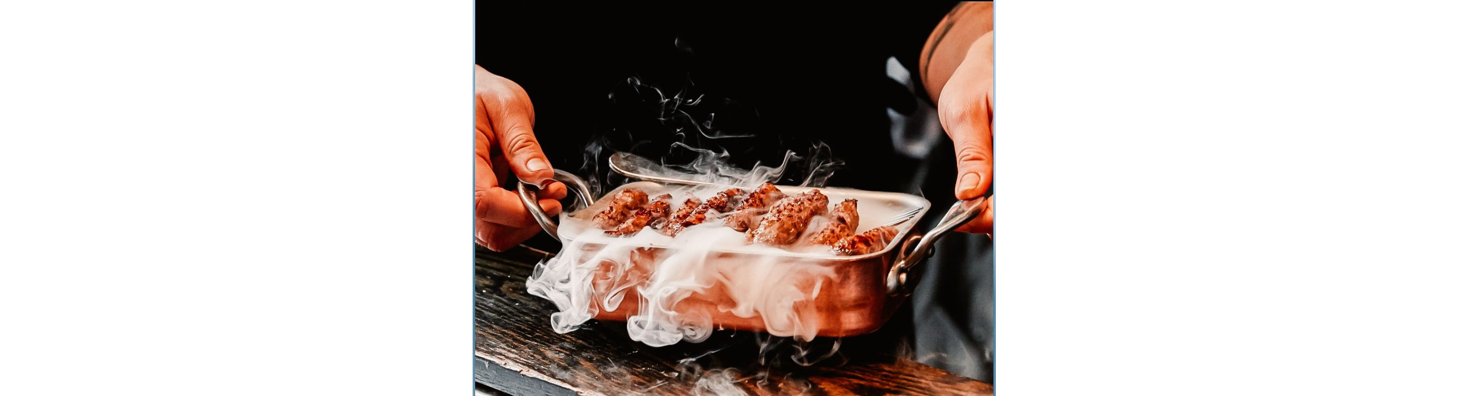 A steaming tray of kebabs.