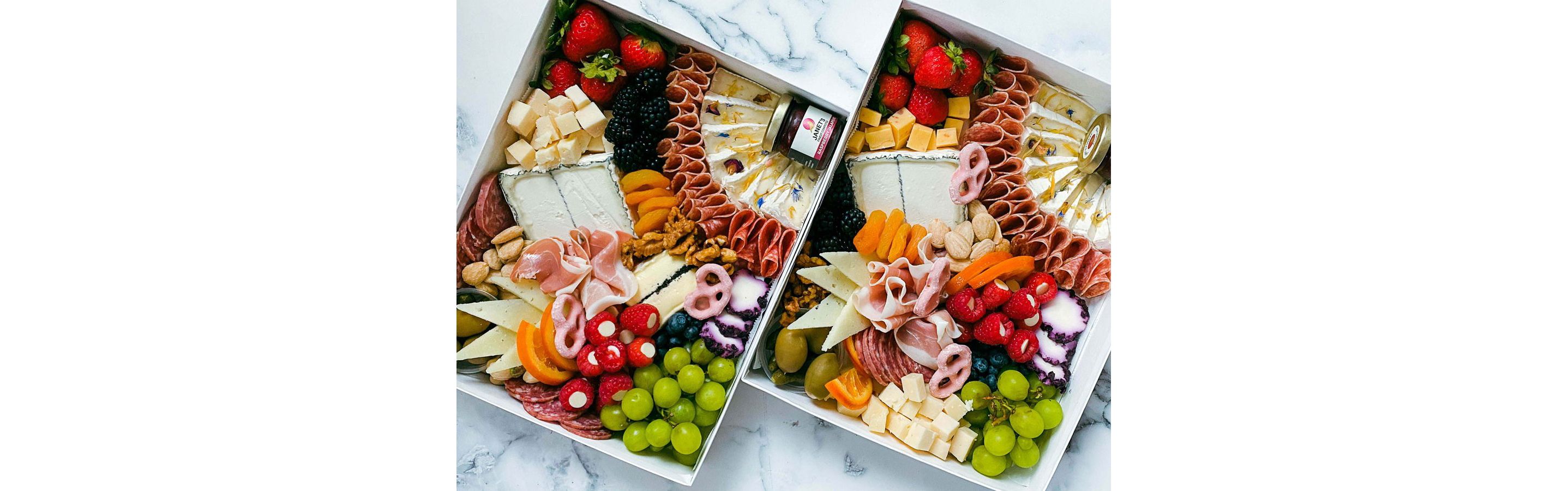 Two large, overflowing picnic boxes.
