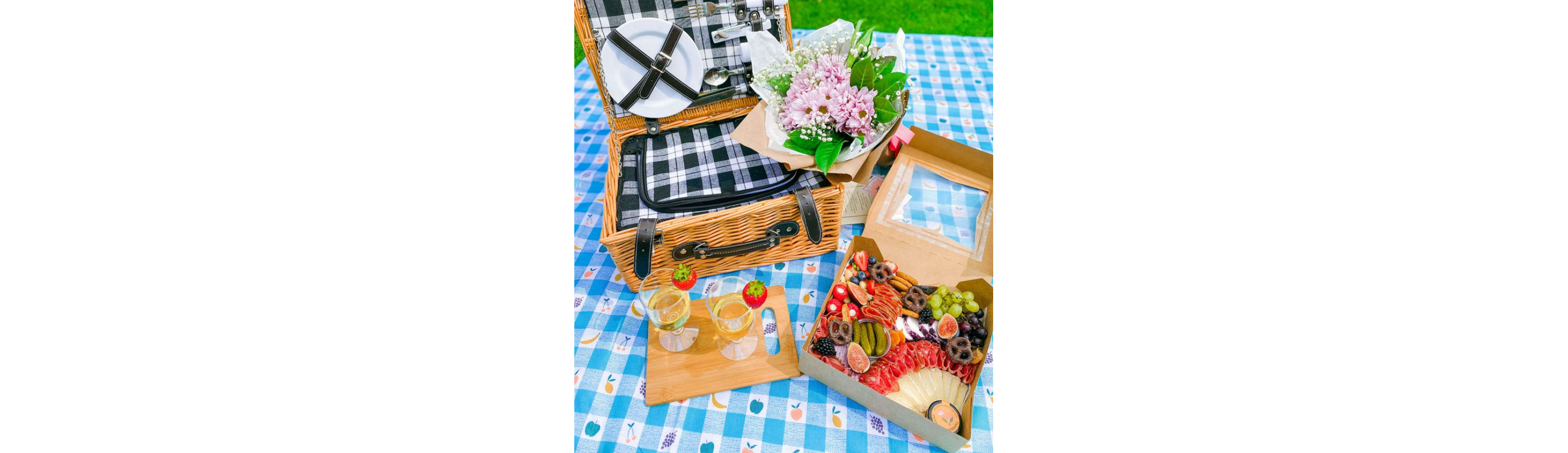 A picnic setting featuring food from Bijou Baskets.