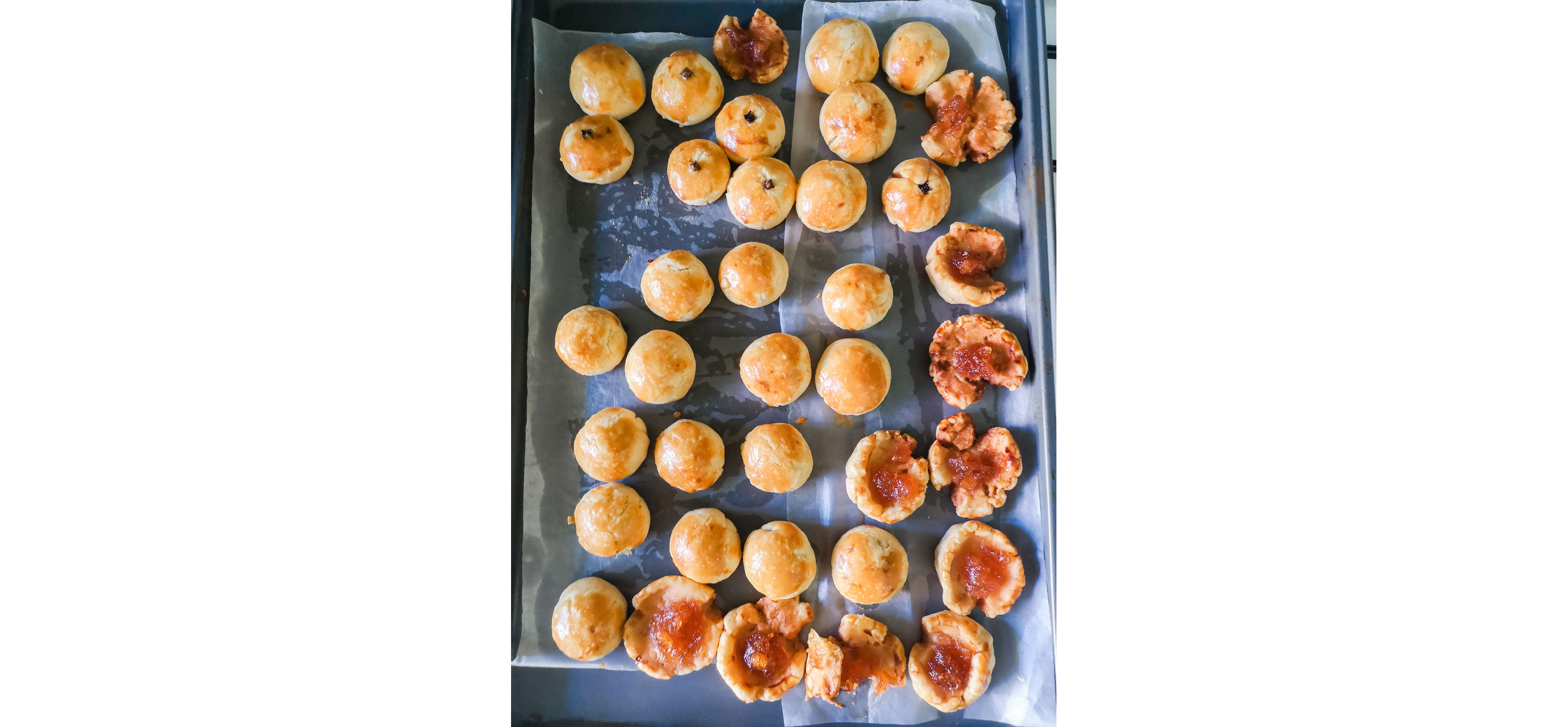 Baked pastries resting on a baking sheet.