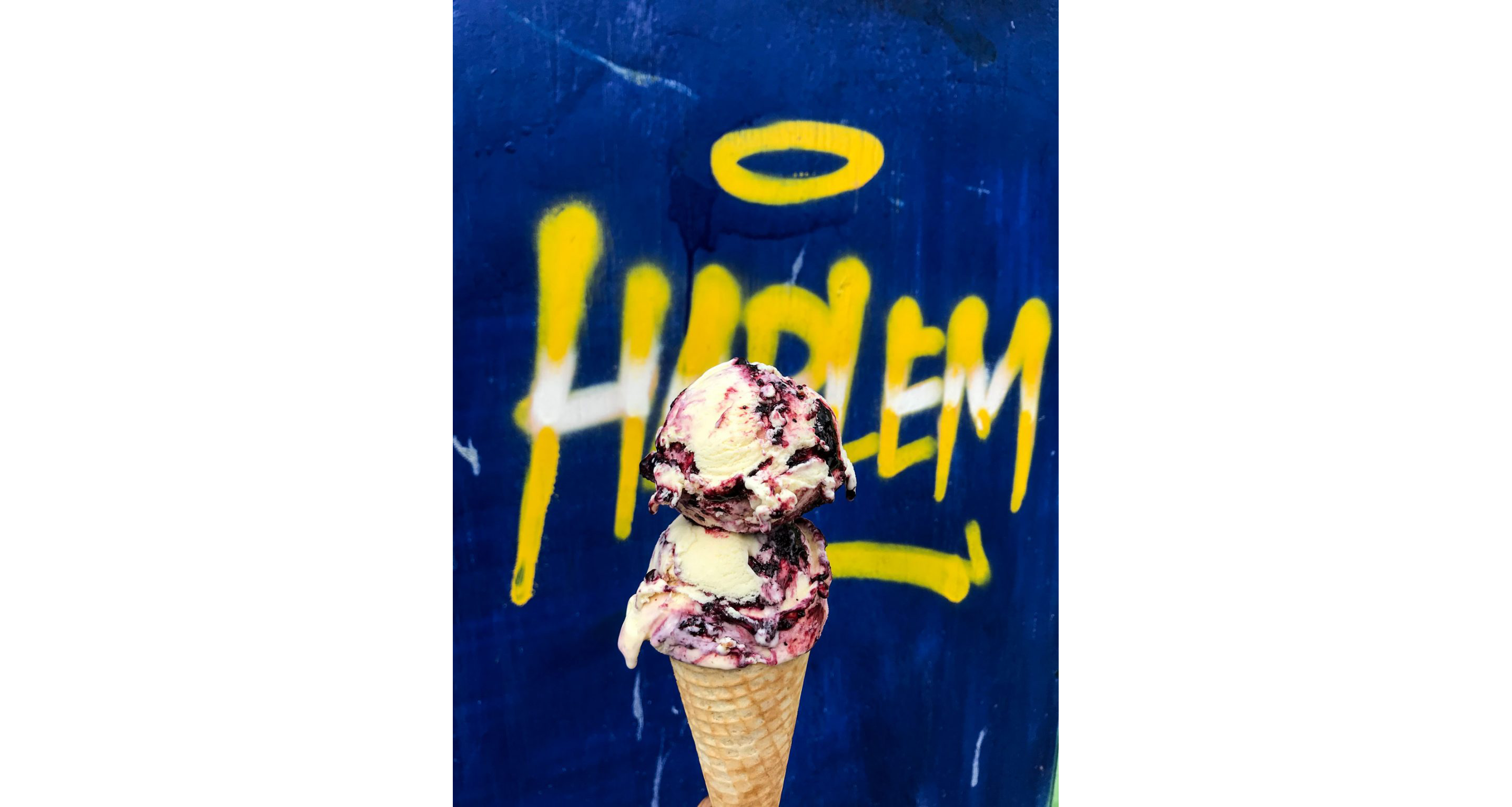 Two scoops of ice cream on an ice cream cone.