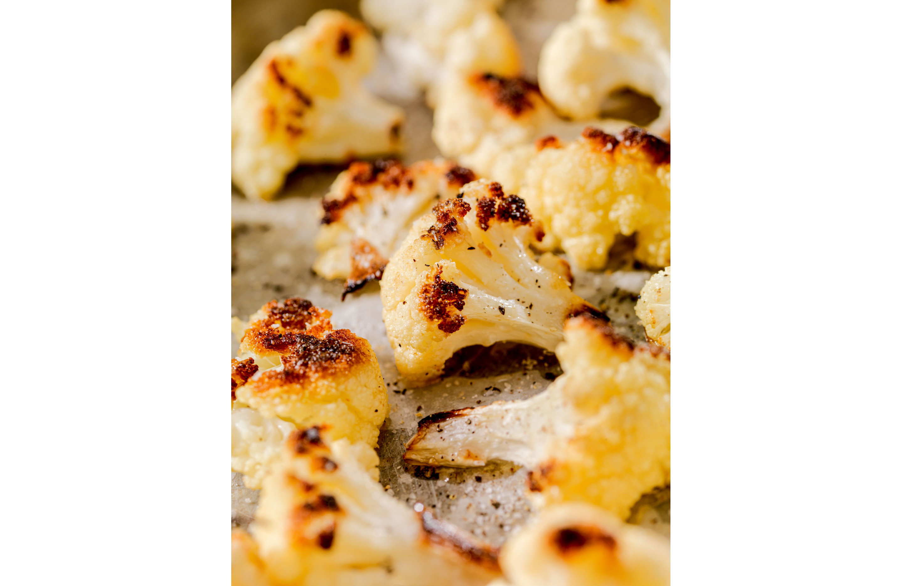Roasted cauliflower sprinkled with seasonings.